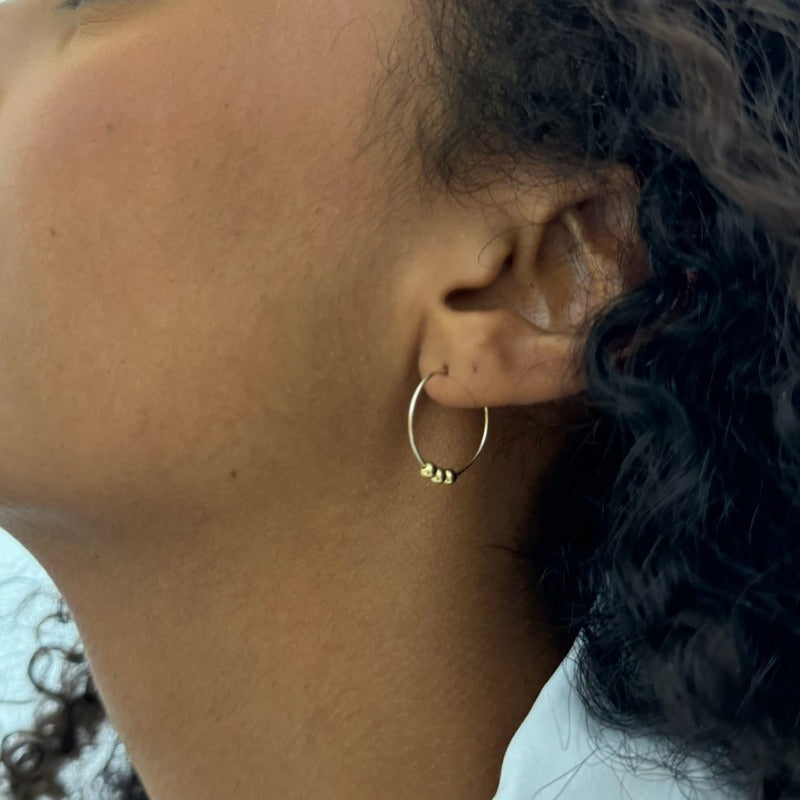 
                      
                        Mini pearl hoop earrings
                      
                    